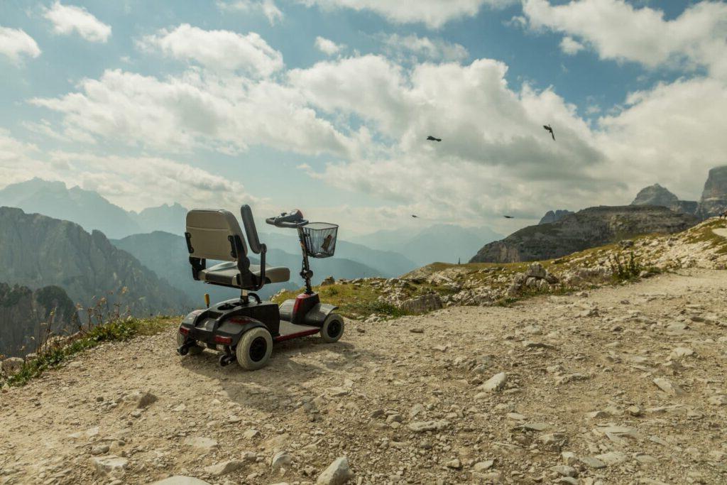 A power scooter on a mountain.